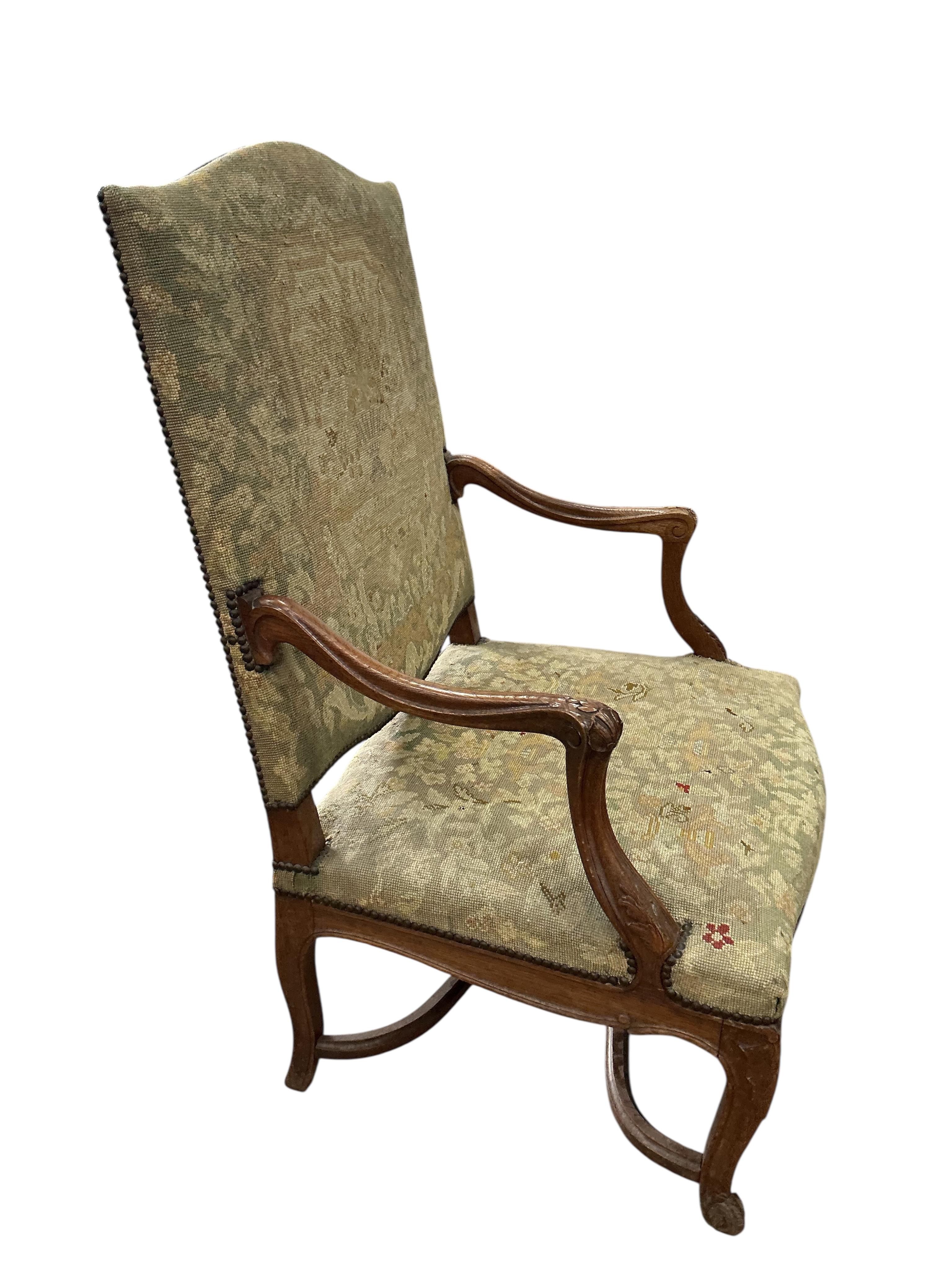 A Louis XV style oak grand fauteuil, width 79cm, depth 66cm, height 113cm, Provenance: The late Kenneth Turner (1936-2025), celebrity florist, designer and perfume retailer, he received the Royal Warrant from the Prince